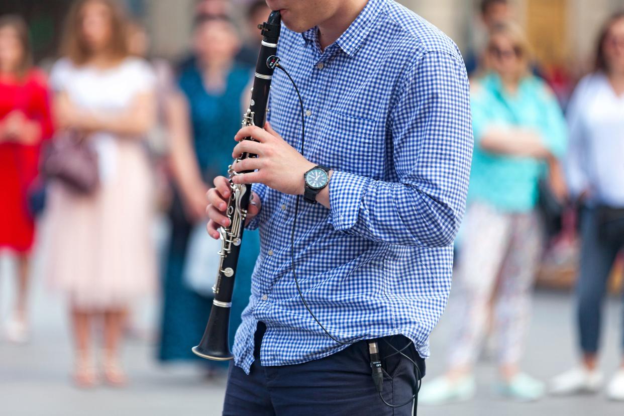 musician playing with his electric clarinet