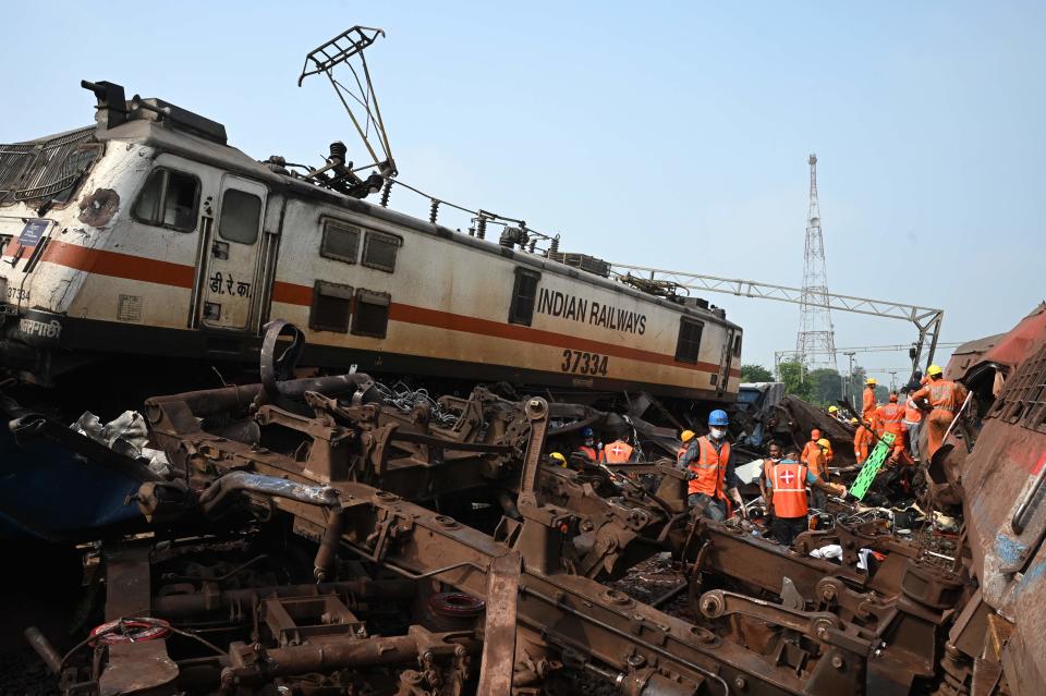 Rescue workers search for survivors amid wreckage at the accident site of a three-train collision near Balasore, about 200 km (125 miles) from the state capital Bhubaneswar in the eastern state of Odisha, on June 3, 2023. At least 288 people were killed and more than 850 injured in a horrific three-train collision in India, officials said on June 3, the country’s deadliest rail accident in more than 20 years (AFP via Getty Images)