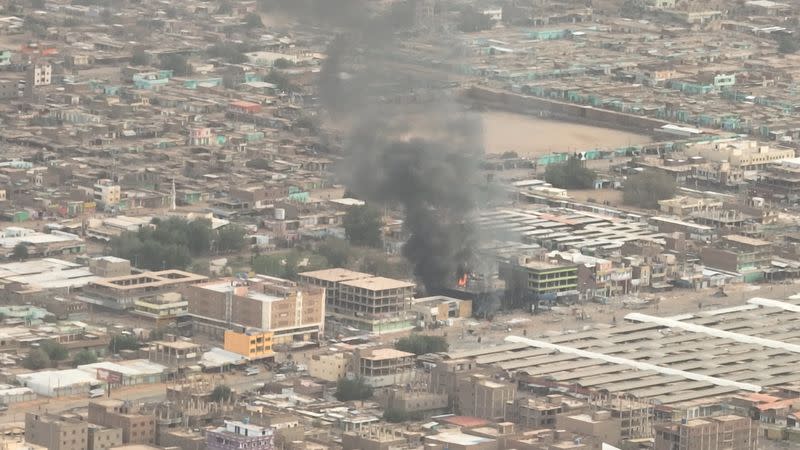 Plumes of smoke and fire at an Omdurman National Bank branch, in Omdurman