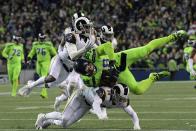 <p>Seattle Seahawks tight end Jimmy Graham (88) is defended by Los Angeles Rams defensive back Lamarcus Joyner (20) and defensive back Cody Davis (38) on a 31-yard reception during a NFL football game at CenturyLink Field. Mandatory Credit: Kirby Lee-USA TODAY Sports </p>