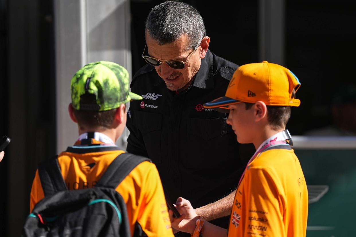 Guenther Steiner, tam principal of the Haas F1 team, signs hats for fans in the padock area at Circuit of Americas on Saturday Oct. 21, 2023 ahead of the Formula 1 Lenovo United States Grand Prix on Sunday.