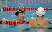 SHANGHAI, CHINA - JULY 26: Natalie Coughlin (L) of the United States reacts after winning the bronze medal in the Women's 100m Backstroke Final during Day Eleven of the 14th FINA World Championships at the Oriental Sports Center on July 26, 2011 in Shanghai, China. (Photo by Adam Pretty/Getty Images)