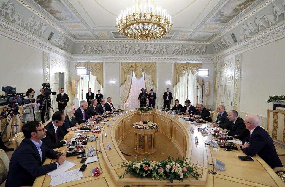 Russian President Vladimir Putin, third right, speaks during a meeting with heads of world's leading news agencies at the St. Petersburg International Economic Forum in St. Petersburg, Russia, Thursday, June 6, 2019. (Yuri Kochetkov/Pool Photo via AP)