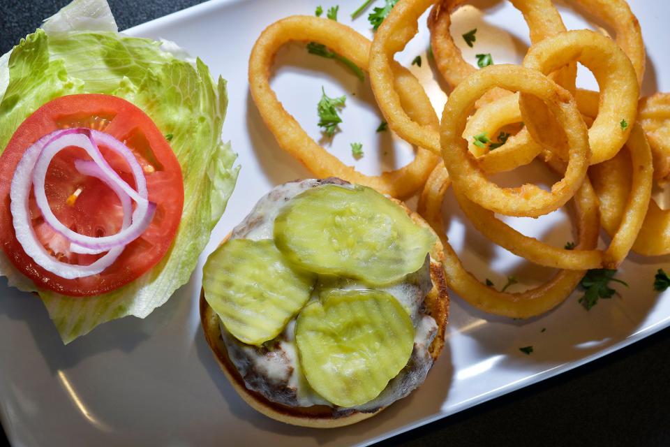 The Build Your Own Burger with onion rings is among the signature menu items at the newly opened second Players Grille in Mandarin. The popular Jacksonville sports bar has new owners who plan to take the family-friendly restaurant nationwide.