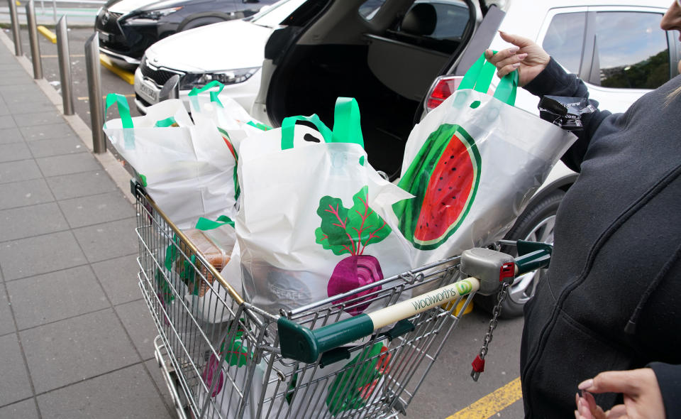 A shopper unloads her re-useable plastic bags provided by Woolworths at Wolli Creek, Sydney. Source: Reuters