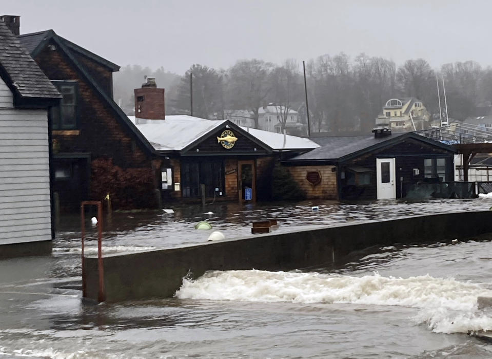 Waterfront businesses are flooded at high tide during a powerful storm, Wednesday, Jan. 10, 2024, in Camden, Maine. Maine coastal communities suffered extensive damage from the storm. (Jane Babbitt via AP)