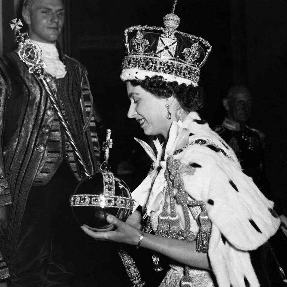 The Queen arrives at Buckingham Palace after her coronation in 1953 - Corbis Historical