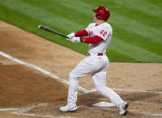 Philadelphia Phillies' JT Realmuto watches his two-run home run during the seventh inning of the team's baseball game against the St. Louis Cardinals, Friday, April 16, 2021, in Philadelphia. (AP Photo/Laurence Kesterson)