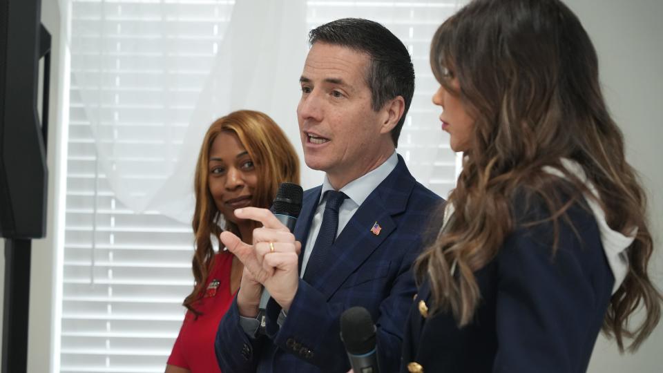 Businessman Bernie Moreno campaigns with state Sen. Michele Reynolds, left, and South Dakota Gov. Kristi Noem at the Destiny Center in Columbus on March 11.