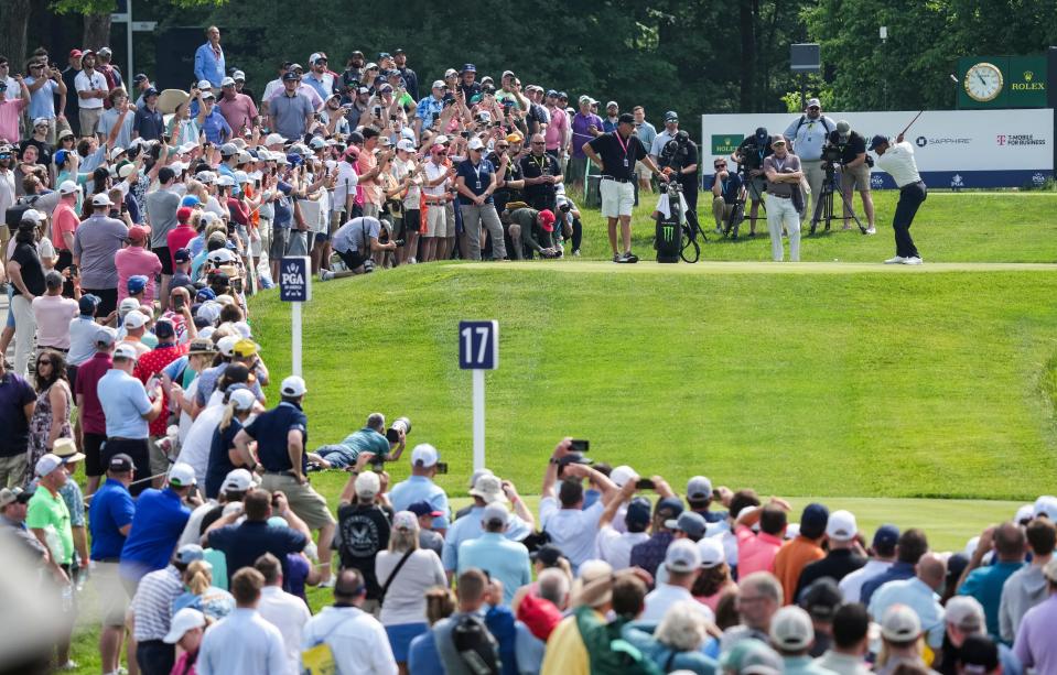Tiger Woods drives off on the 17th tee as a large crowd of spectators watch during the 2024 PGA Championship practice Monday at Valhalla Golf Course in Louisville, Ky. May 13, 2024.