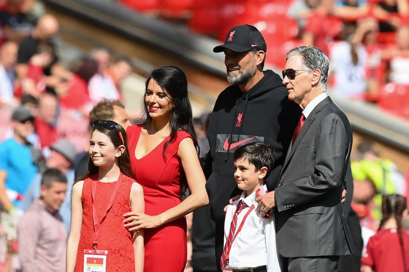 Jürgen Klopp poses for a picture with FSG chief John W Henry and his family.