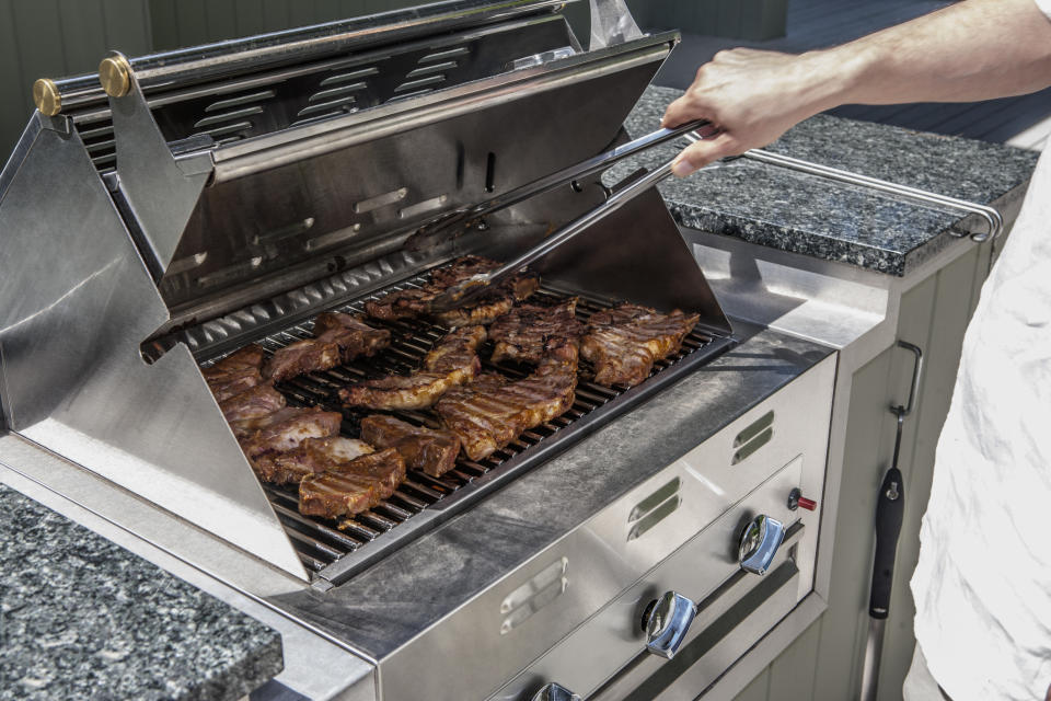 Steaks on a grill.