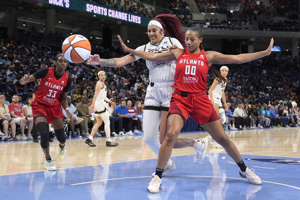 Atlanta Dream's Naz Hillmon (00) blocks out Chicago Sky's Kamilla Cardoso on a ball headed out of bounds during the second half of a WNBA basketball game Wednesday, July 10, 2024, in Chicago. (AP Photo/Charles Rex Arbogast)