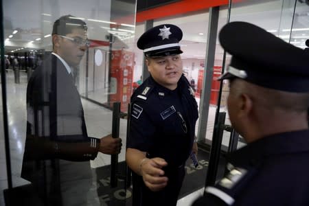 Police officers are seen during a security operation after armed robbers stole gold coins worth more than $2 million outside Casa de Moneda in Mexico City