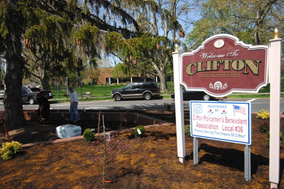 Welcome to Clifton sign in front of the Main Memorial Library and the area the city is looking to build a new firehouse.