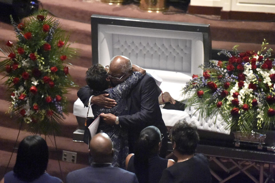 House Majority Whip Jim Clyburn hugs a relative after pausing at the casket of his wife, Emily, during her funeral services on Sunday, Sept. 22, 2019, in West Columbia, S.C. (AP Photo/Meg Kinnard)