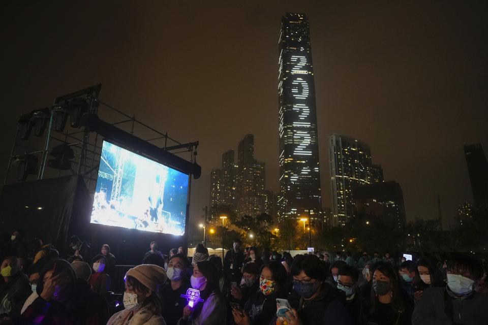 People celebrate during a New Year's Eve concert in Hong Kong Saturday, Jan. 1, 2022. (AP Photo/Vincent Yu)