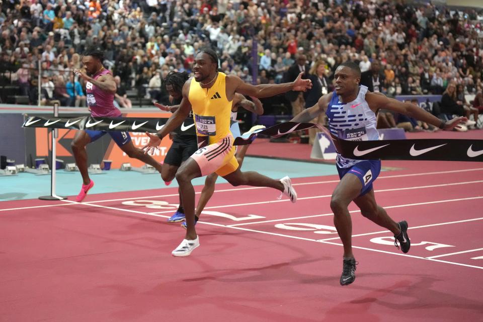 Noah Lyles (second from right) defeats Christian Coleman (right) to win the 60m, 6.43 to 6.44, during the USATF Indoor Championships at Albuquerque Convention Center.