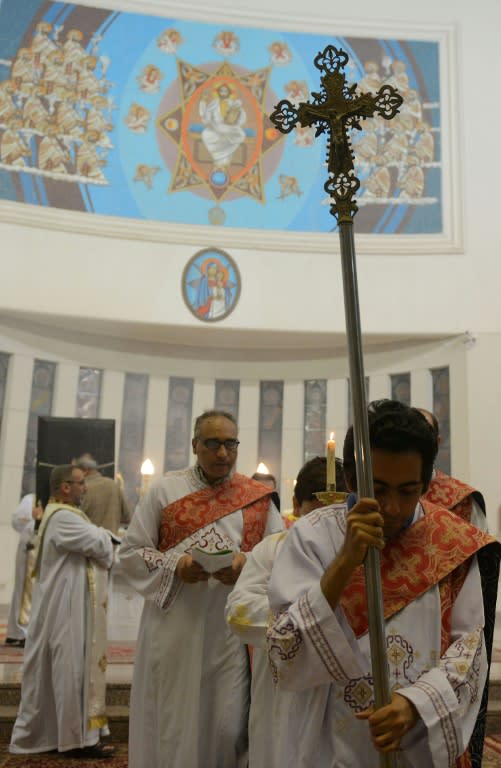 Clergymen attend Sunday Mass at Saint Mary's church in the Egyptian capital Cairo, on April 23, 2017, ahead of Pope Francis' visit