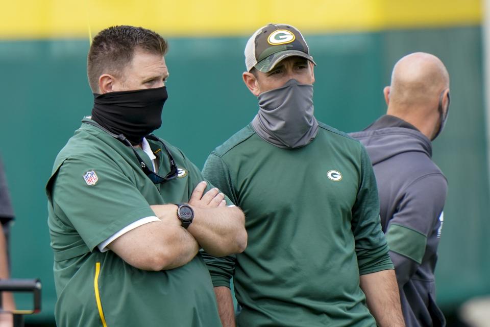 Green Bay Packers head coach Matt LaFleur talks to general manager Brian Gutekunst during NFL football training camp Saturday, Aug. 15, 2020, in Green Bay, Wis. (AP Photo/Morry Gash)