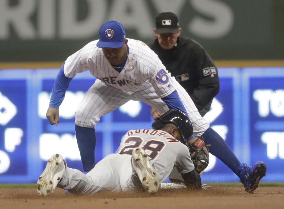 Detroit Tigers' Niko Goodrum is out at second as Milwaukee Brewers' Jonathan Schoop tags him out attempting to steal second during the first inning of a baseball game Saturday, Sept. 29, 2018, in Milwaukee. (AP Photo/Morry Gash)
