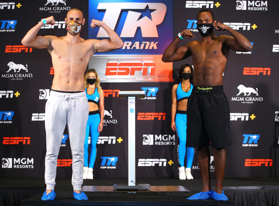 The manager of lightweight Mikkel LesPierre (R) tested positive for Covid-19 Wednesday, forcing the cancellation of his bout against Jose Pedraza, which had been slated to be the main event of an ESPN card tonight in Las Vegas. (Mikey Williams/Top Rank)