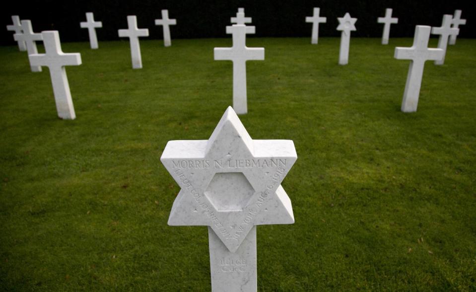 FILE In this Dec. 18, 2013 file photo, the grave of World War One soldier, Lt. Col. Morris Liebmann, is photographed at the Flanders Field American Cemetery in Waregem, Belgium. The cemetery contains the remains of 368 U.S. WWI military and support personnel. Of those remains, 21 are unknown and could not be identified. On Wednesday, March 26, 2014 President Barack Obama will honor those Americans who died in a struggle so all-encompassing, so horrific, it simply became known as the Great War. Liebmann is the highest ranking officer in the cemetery. (AP Photo/Virginia Mayo, File)