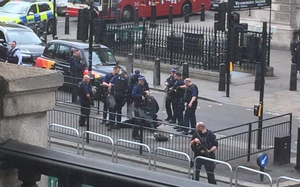 Armed police tackle the suspect in Westminster - Credit: Dev Howard/TWITTER