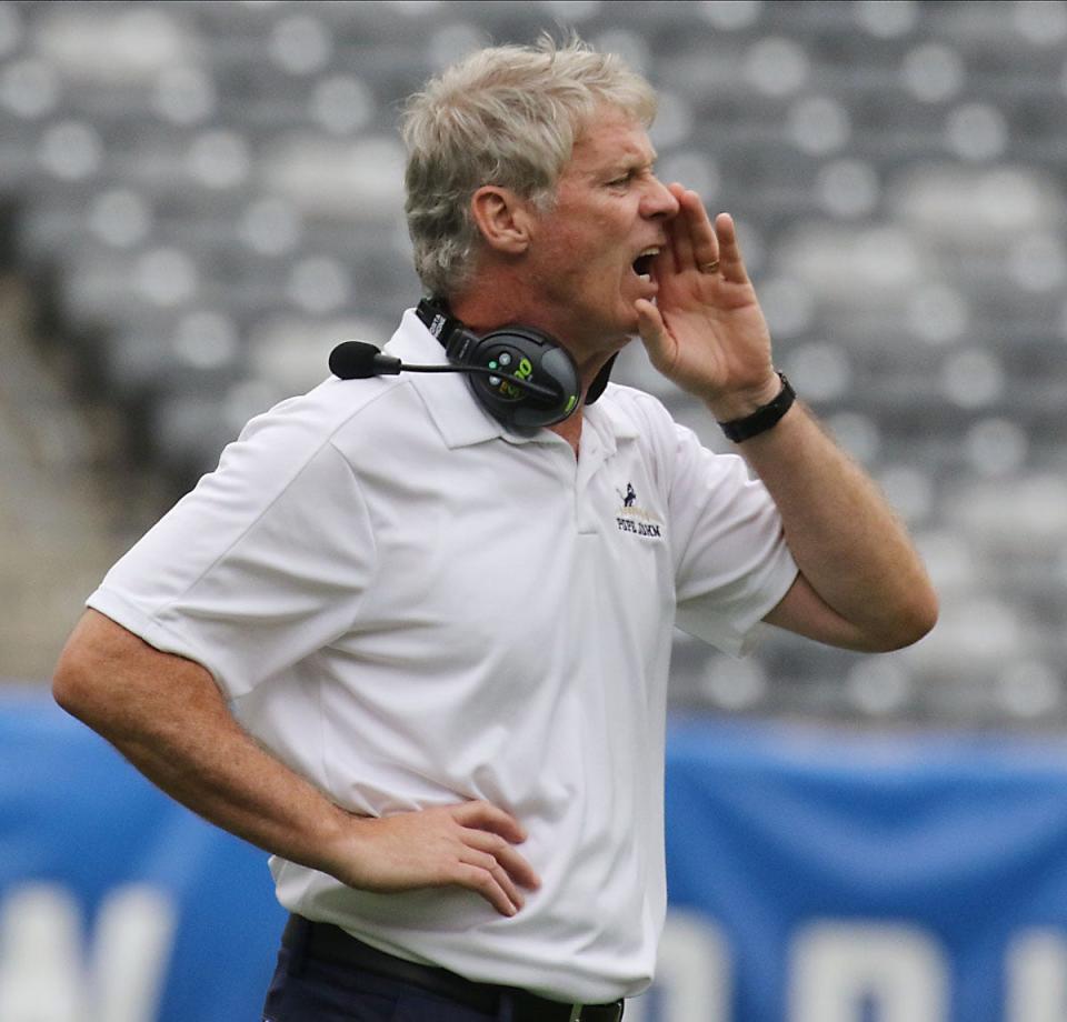 Pope John head coach Brian Carlson with is team in the first half during the Battle for the Bridge High School Football competition at Metlife Stadium in East Rutherford , NJ on September 14, 2019.