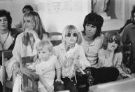 <p>Keith Richards shows that a white henley is perfect kicking-back attire in this photo from Mick Jagger's wedding to Bianca De Macias in Saint-Tropez, France in May 1971. Keith is with his partner, Anita Pallenberg, and their children.</p>