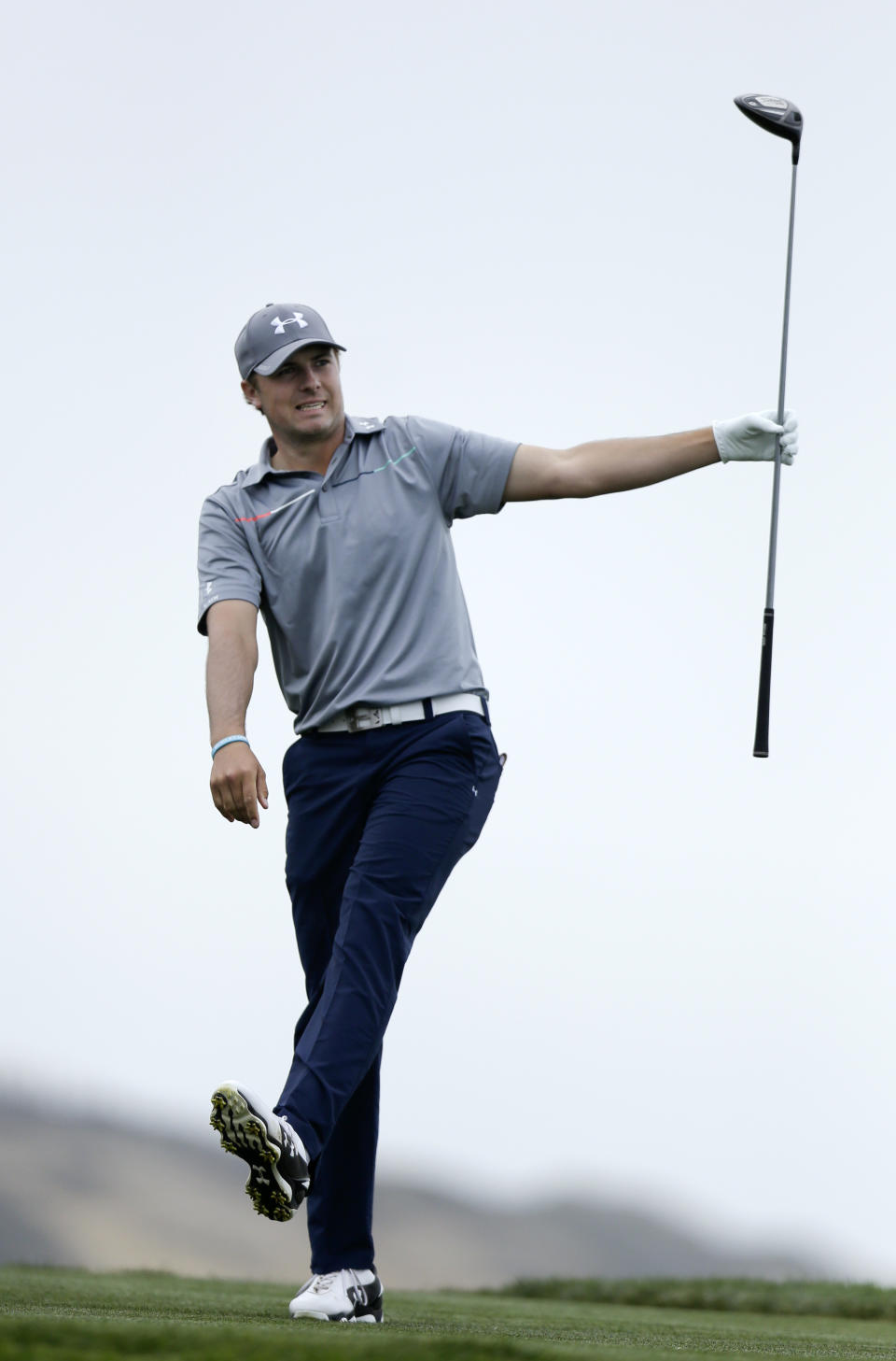 Jordan Spieth reacts as his tee shot flies to the left of the fairway on the fourth hole of the South Course at Torrey Pines during the final round of the Farmers Insurance Open golf tournament Sunday, Jan. 26, 2014, in San Diego. (AP Photo/Gregory Bull)