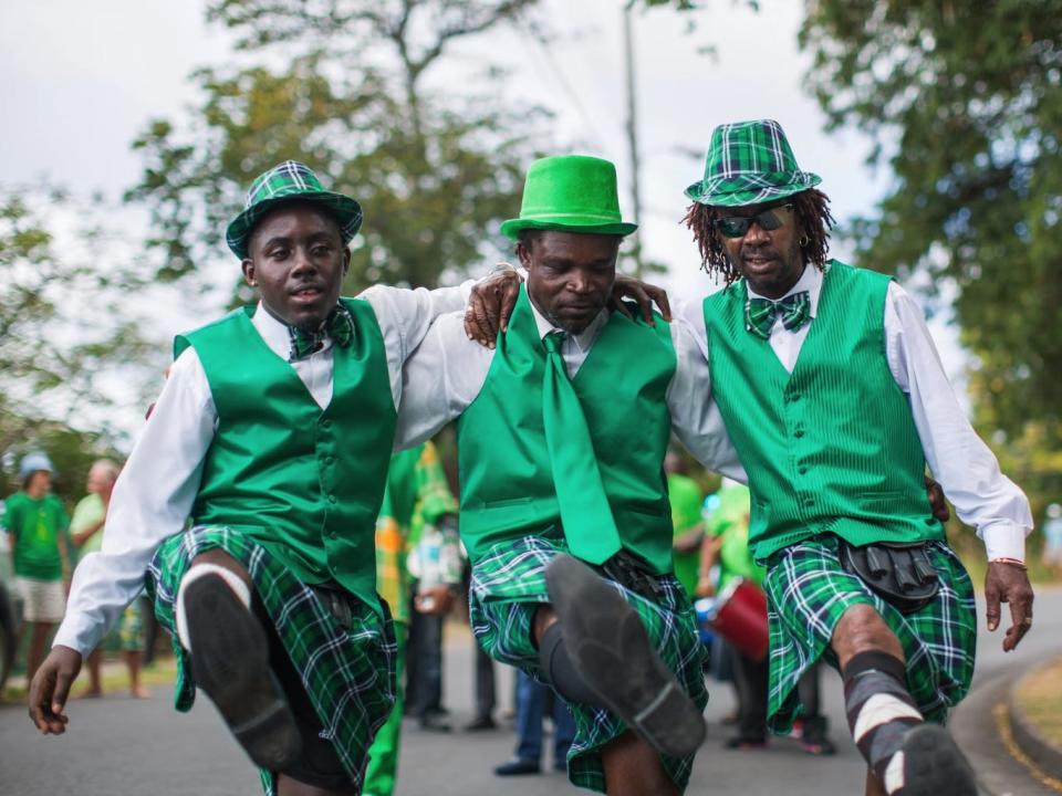 Revelers in green dance at the Montserrat St Patrick's Day celebration