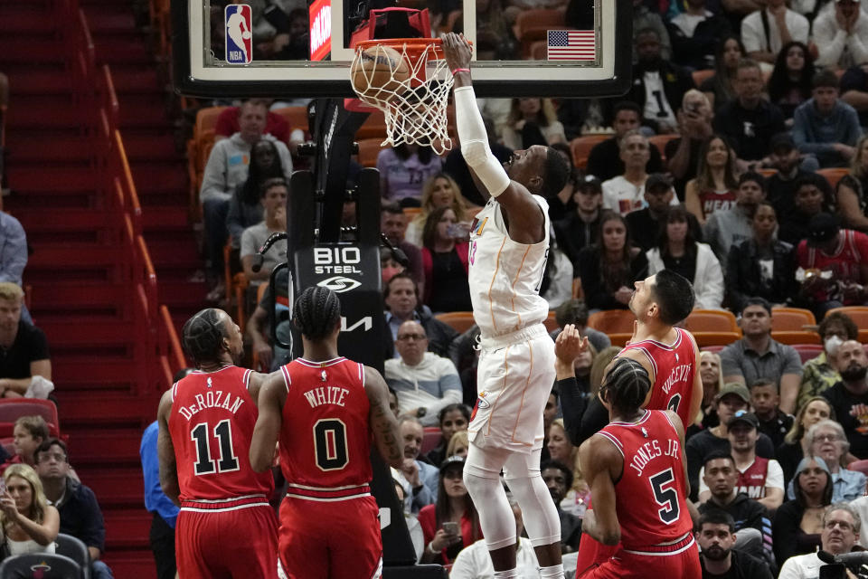 Miami Heat center Bam Adebayo dunks during the first half of an NBA basketball game against the Chicago Bulls, Tuesday, Dec. 20, 2022, in Miami. (AP Photo/Lynne Sladky)