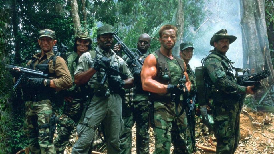 Predator cast standing next to each other