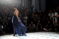 A model walks the runway at the Jason Wu spring 2013 show, Friday, Sept. 7, 2012 in New York. (Photo by Diane Bondareff/Invision/AP)