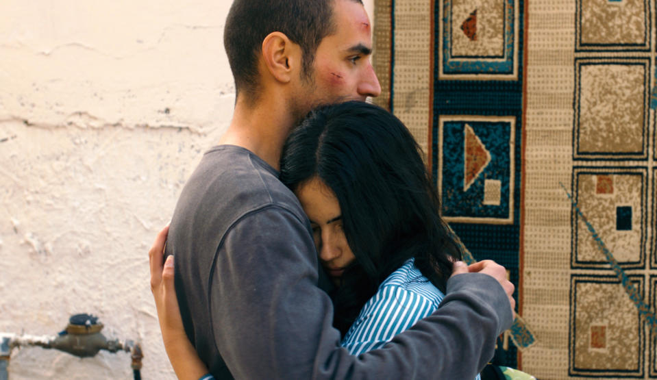 This film image released by Adopt Films shows Adam Bakri, left, and Leem Lubany in a scene from the film "Omar." The film was nominated for an Academy Award for best foreign picture on Thursday, Jan. 16, 2014. The 86th Academy Awards will be held on March 2. (AP Photo/Adopt Films)