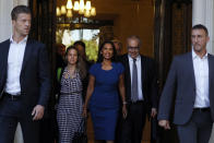 Anti-Brexit campaigner Gina Miller, centre, leaves The Supreme Court flanked by security, in London, Tuesday, Sept. 17, 2019. The Supreme Court is set to decide whether Prime Minister Boris Johnson broke the law when he suspended Parliament on Sept. 9, sending lawmakers home until Oct. 14 — just over two weeks before the U.K. is due to leave the European Union.(AP Photo/Alastair Grant)