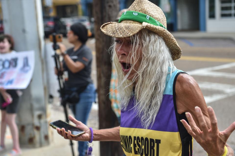 Derenda Hancock, clinic escort, yells at anti-abortion protestors blocking drivers outside of the Jackson Women’s Health Organization on the last day the clinic is legally allowed to be open in in Jackson on Wednesday, July 6, 2022