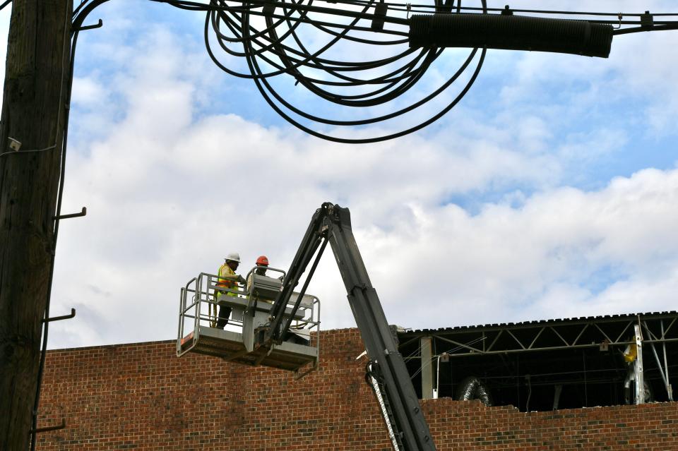 DEMTEK LLC remove brick on exterior of the former Spartanburg Herald Journal at 189 West Main Street in downtown Spartanburg Thursday, June 27, 2024.