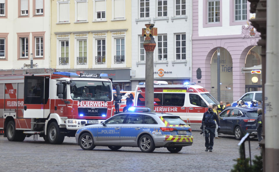 A square is blocked by the police in Trier, Germany, Tuesday, Dec. 1, 2020. German police say two people have been killed and several others injured in the southwestern German city of Trier when a car drove into a pedestrian zone. Trier police tweeted that the driver had been arrested and the vehicle impounded. (Harald Tittel/dpa via AP)