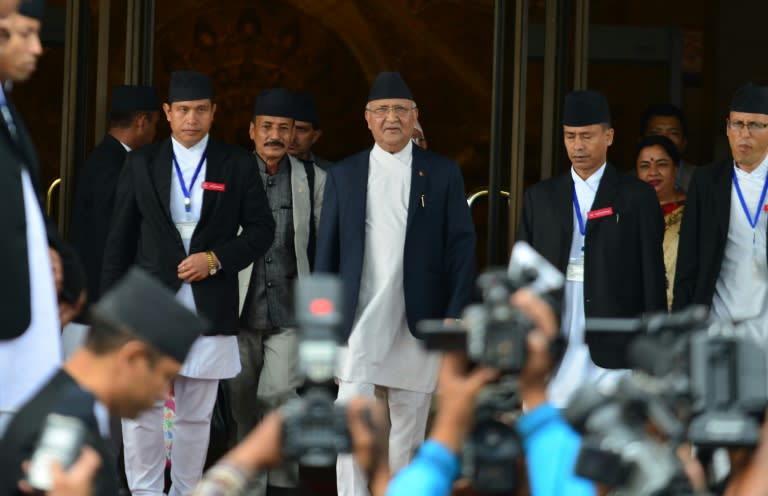 K.P. Sharma Oli, (C) leaves the Parliament Building in Kathmandu, on July 21, 2016