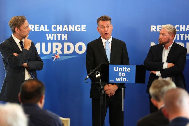 Murdo Fraser speaking on a Tory lectern reading 'Unite to win'