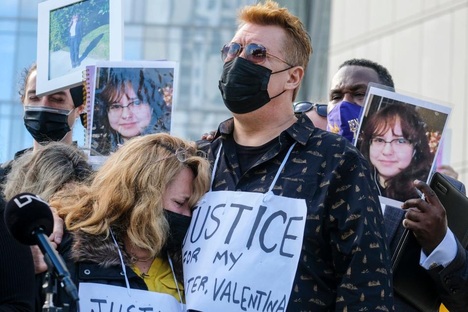 Soledad Peralta and Juan Pablo Orellana Larenas, the parents of Valentina Orellana-Peralta, attend in a news conference outside the Los Angeles Police Department headquraters in Los Angeles, Tuesday, Dec. 28, 2021. The parents of Valentina Orellana-Peralta, the 14-year-old girl killed by a stray bullet fired by an LAPD officer at a North Hollywood clothing store last week, and their attorneys held a news conference to discuss the family's demand for transparency from the Los Angeles Police Department. (AP Photo/Ringo H.W. Chiu) ORG XMIT: CARC103