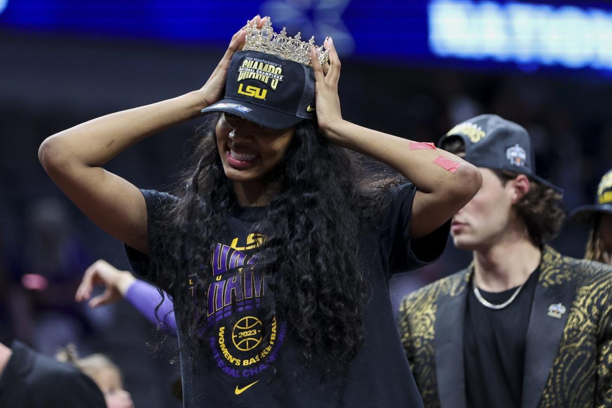 LSU Lady Tigers forward Angel Reese celebrates after defeating the Iowa Hawkeyes during the final round of the Women's Final Four NCAA tournament at the American Airlines Center.
