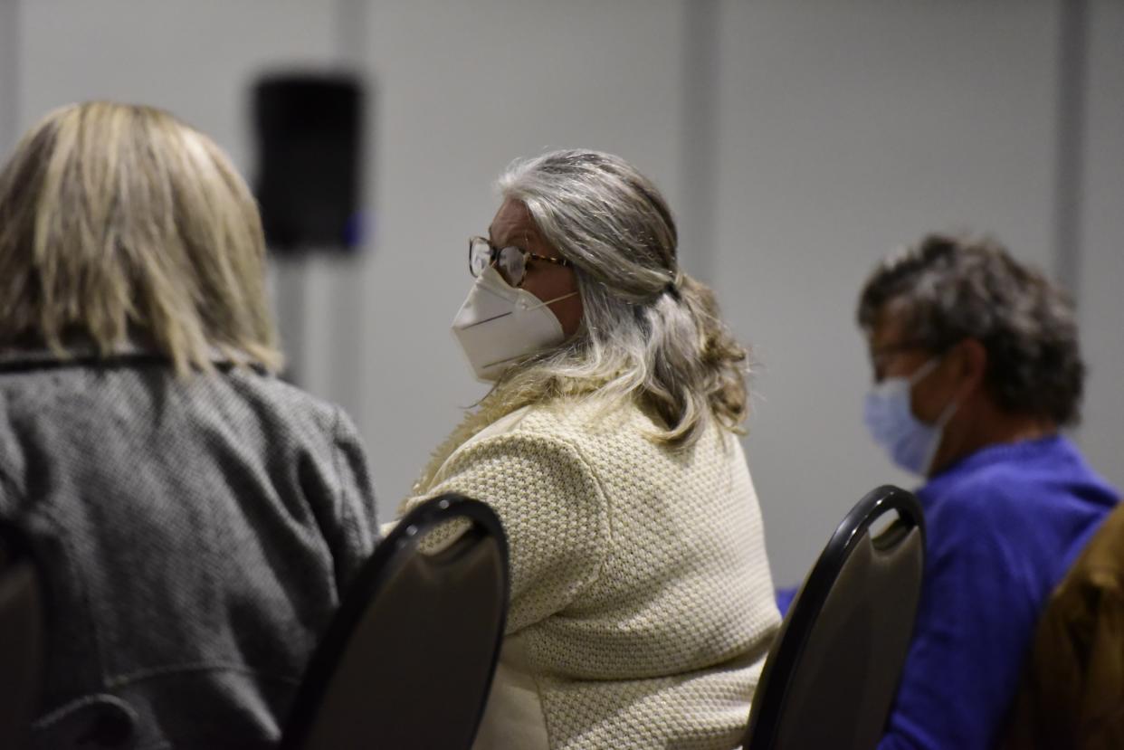 Dr. Annette Mercatante listens to St. Clair County Board of Commissioners discuss her position during the St. Clair County Board of Commissioners meeting at the Blue Water Convention Center in Port Huron on Thursday, Feb. 17, 2022.