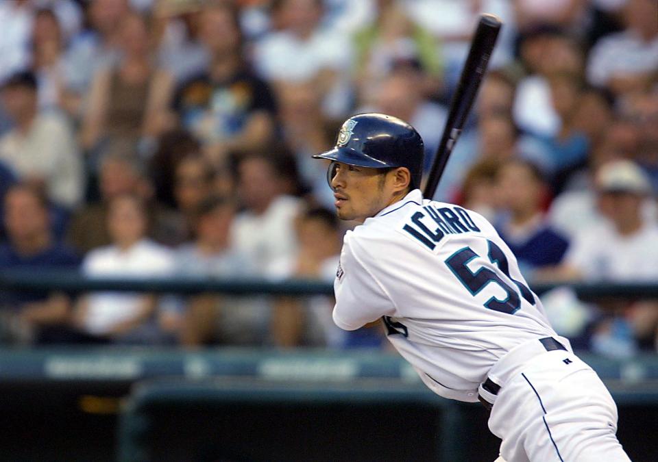 Seattle Mariner Ichiro Suzuki hits a double against the Toronto Blue Jays during second inning play of their game in Seattle 08 August, 2001.  AFP PHOTO/Dan Levine (Photo by DAN LEVINE / AFP) (Photo by DAN LEVINE/AFP via Getty Images)