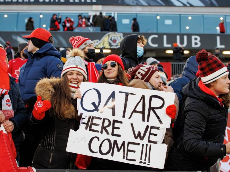 Fans celebrate in the stands after Canada’s 2-0 win against the United States in a men's World Cup qualifying match at Tim Hortons Field in Hamilton in January. (Evan Mitsui/CBC - image credit)