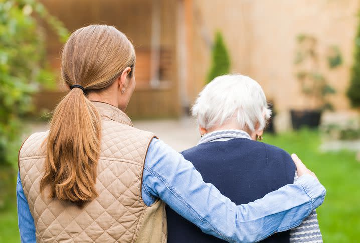 woman helping elderly mother