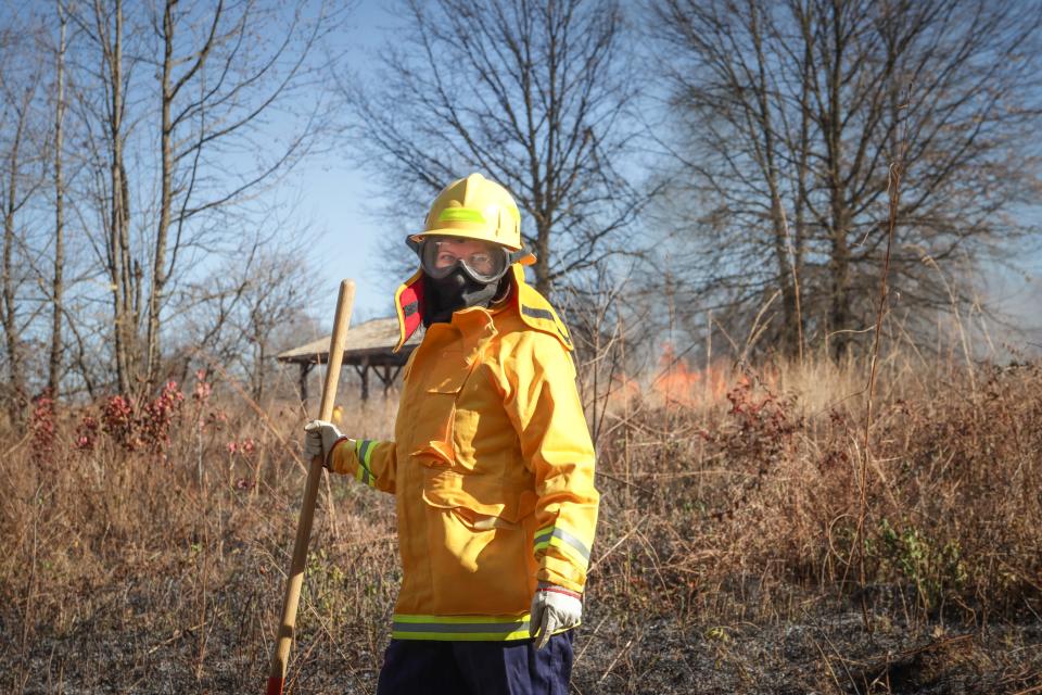 Liz Mortenson Winlock oversees a prescribed burn in the Summit Field prairie habitat of Iroquois Park on Dec. 14, 2023.