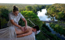 <p><span>A guest receiving an outdoor massage.</span></p>